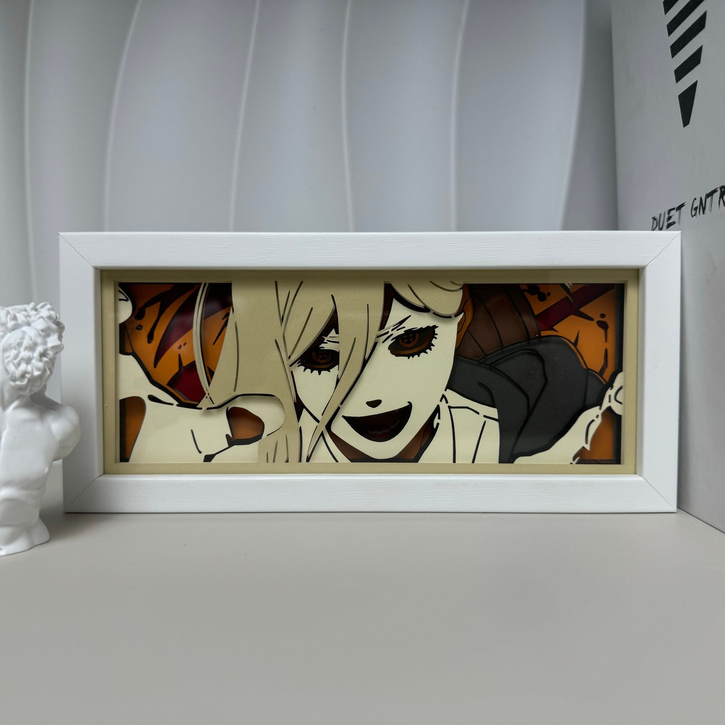 Chainsaw Man Power Smile anime light box by MyAnimeLightbox, display off, in white frame with decorative background