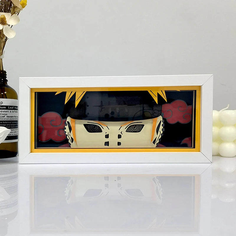 Naruto Six Pain Pain Anime Box by Myanimelightbox ، عرضه ، في إطار أبيض مع خلفية زخرفية