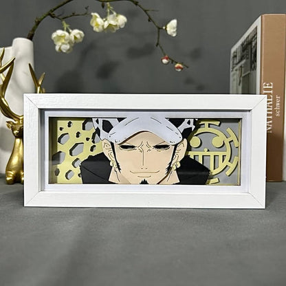 One Piece Trafalgar Law Anime Light Box oleh Myanimelightbox, dipaparkan, dalam bingkai putih dengan latar belakang hiasan