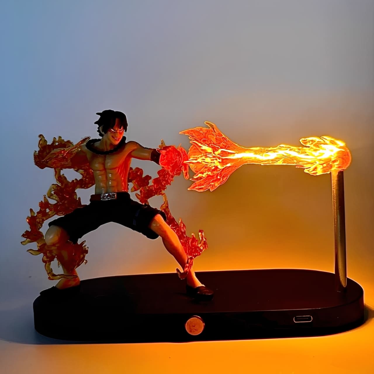 Front view of Ace fire attack figure lamp with bright orange LED flame.
