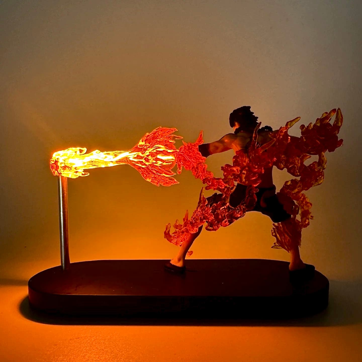 Side view of Ace fire blast figure lamp featuring dynamic flaming LED effects.

