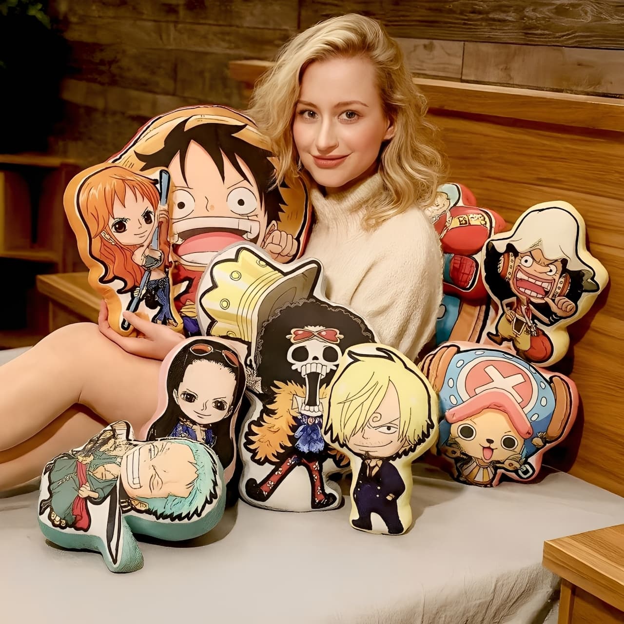 Smiling woman holding a full set of anime chibi character pillows, ideal as cute decorative gifts for fans.