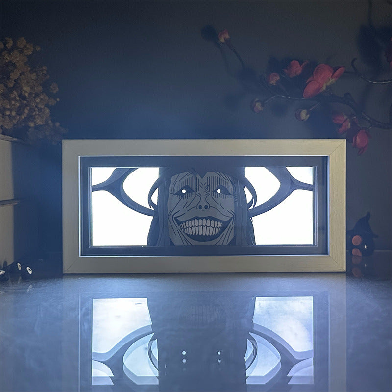 Absolutní bytost ze sólového vyrovnávání Anime LED Light Box s barevnou oční záře zobrazenou na lesklém bílém povrchu