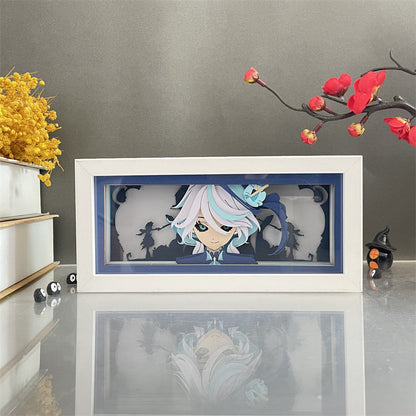Boîte à lumière Genshin Impact Wanderer montrant une vue de face avec un art en papier détaillé et un décor de cadre blanc.
