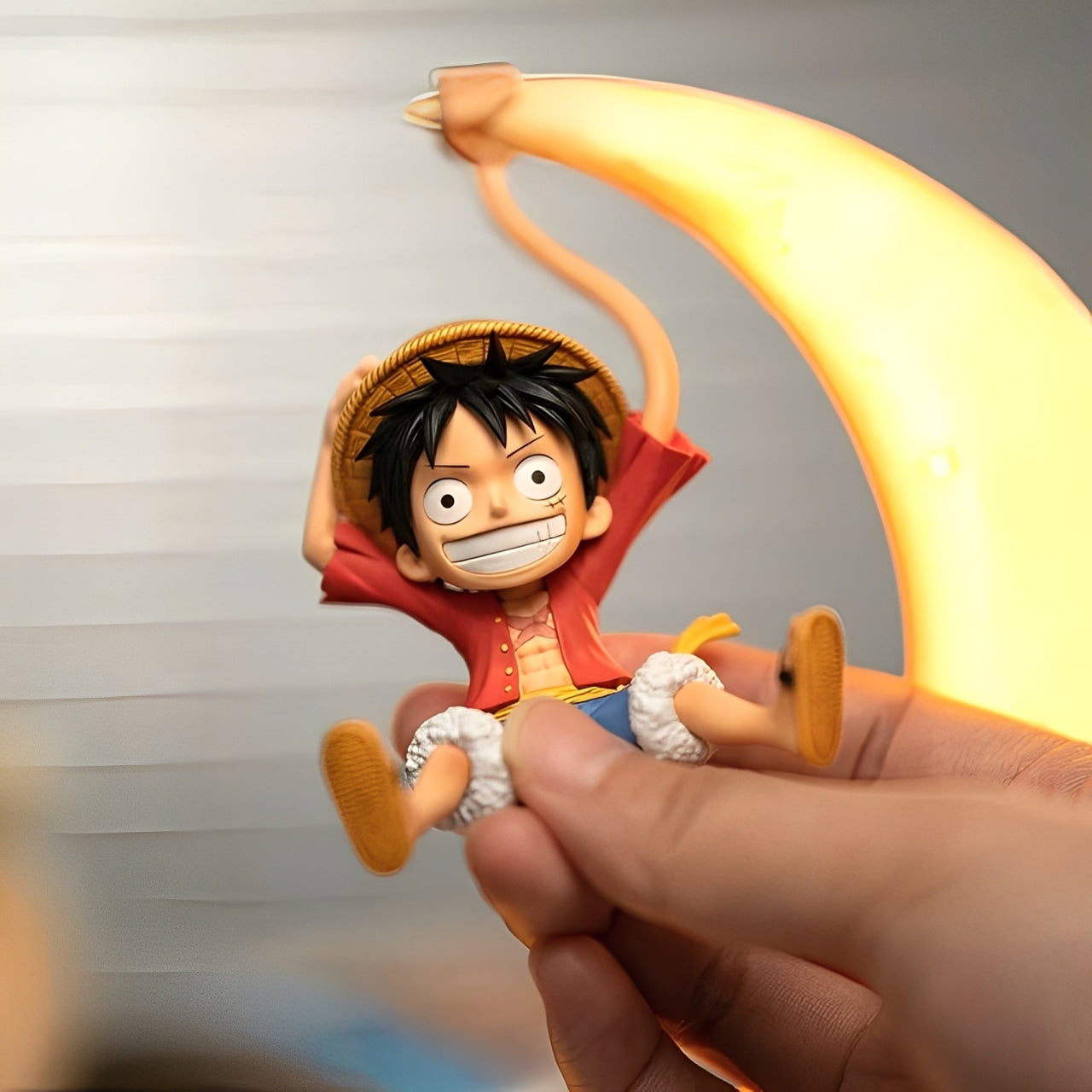 Close-up of removable Luffy figure with stretchable arm from One Piece moon night light.