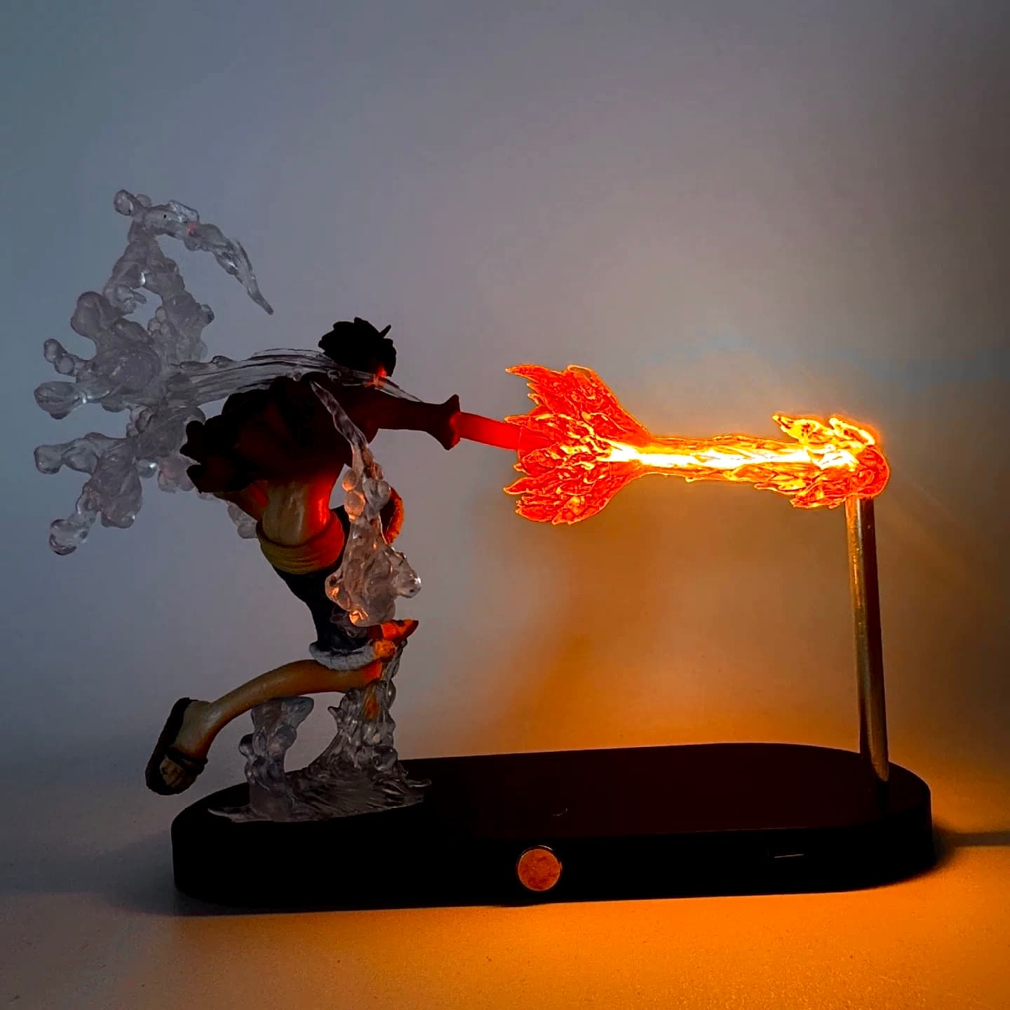 Back view of Luffy Fire Fist LED statue with smoke effect and flame blast
