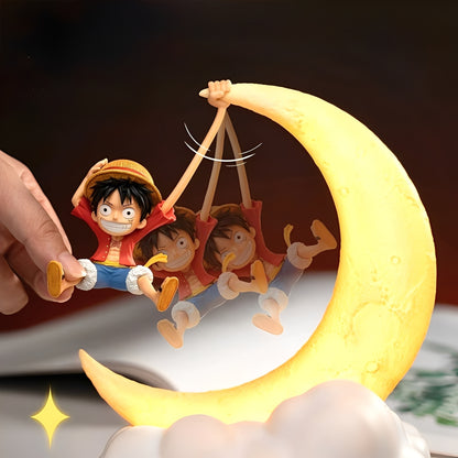 Luffy figure being stretched while hanging on magnetic glowing moon night light.
