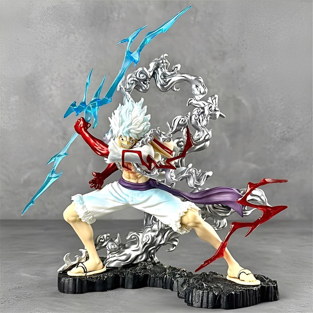 Nika Luffy Gear 5 figure in battle pose with red haki lightning and swirling cloud effects.