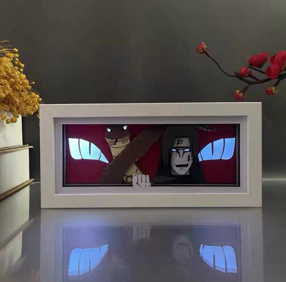Boîte lumineuse à LED anime Orochimaru avec une lueur oculaire double couleur affichée sur une surface blanche brillante